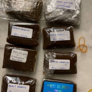 WPFF Ice Hash – golden-brown, solventless cannabis concentrate made using ice water extraction, displayed in a glass jar on a clean surface.