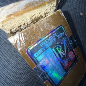 Premium dry sift hash – golden, fine-textured cannabis concentrate made from pure trichomes, solventless and handcrafted