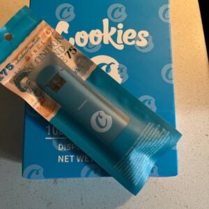 Cookies THC disposable vape pen with golden oil, sleek design, and clear branding for easy, on-the-go use.