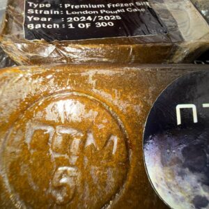 Buy ON THE MOON premium frozen sift hash – golden, solventless concentrate with a sandy texture, rich in trichomes, perfect for dabbing or vaping.