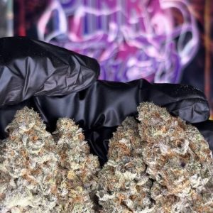 Buy Pink Runtz strain online showing colorful cannabis buds with frosty trichomes and sweet terpene profile.