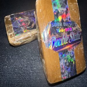 Buy double static hash online showing ultra-refined sandy trichomes with premium solventless quality.